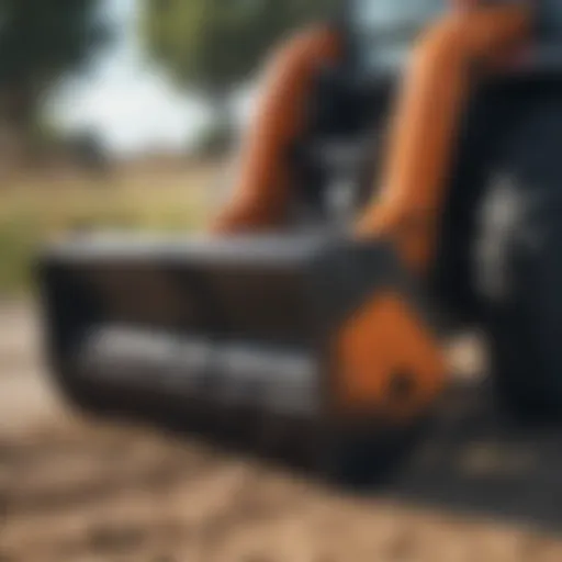 Close-up of a skid steer angle broom attachment at work.