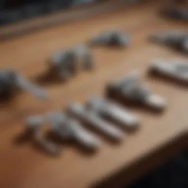 Various types of slide bolt latches displayed on a workbench