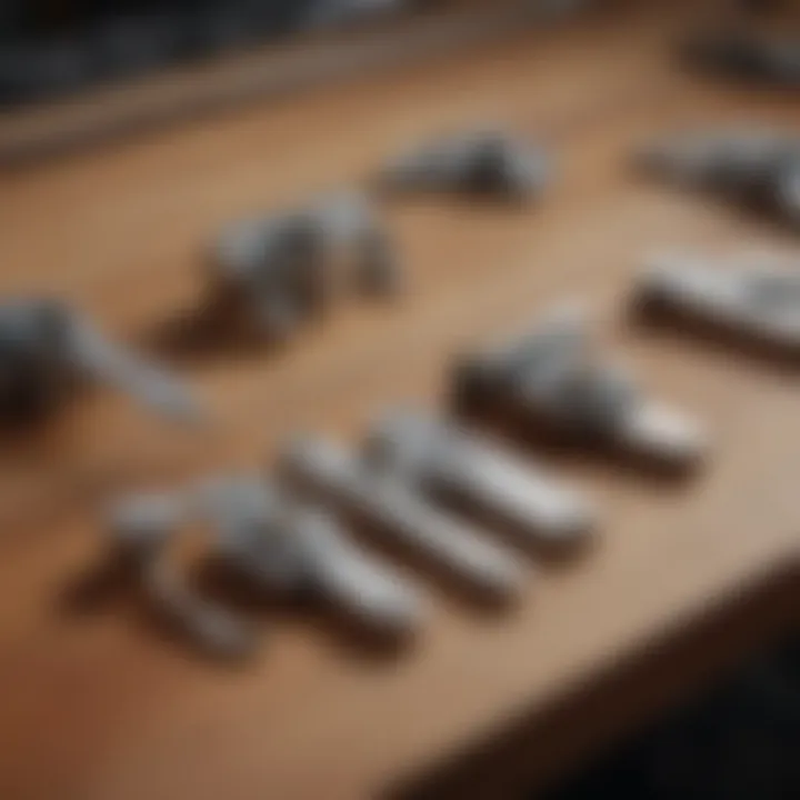Various types of slide bolt latches displayed on a workbench