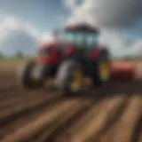 A tractor equipped with a ground rake in a field