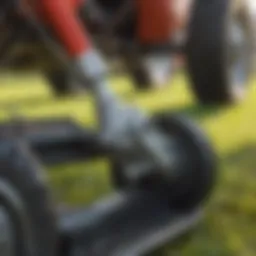 Close-up view of a foot throttle mechanism in a lawn mower.