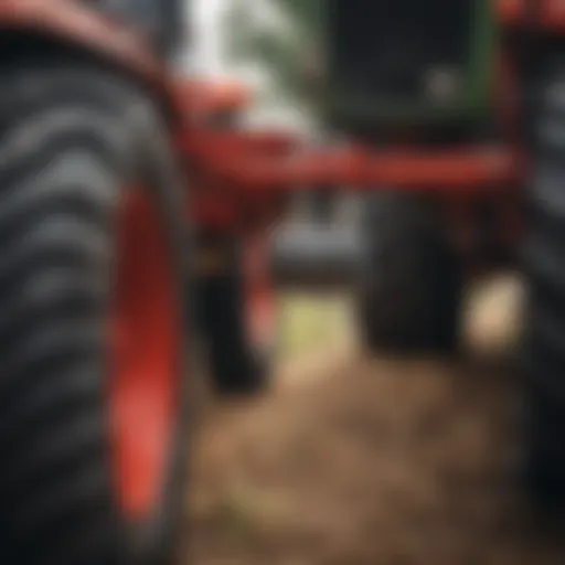 Close-up view of a plug aerator attachment on a tractor